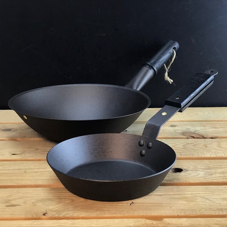 Ebonised black oak handles on spun iron pans