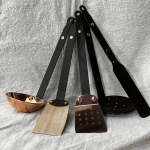 Utensils: Black iron, copper and beech wood kitchen tools