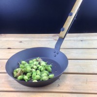 Outdoor cooking fun with long handled roasting and frying pans